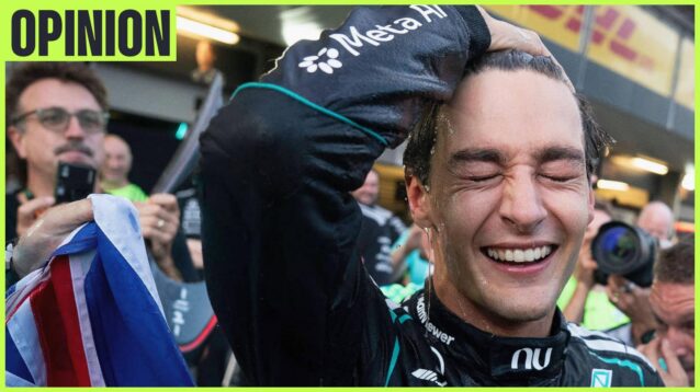 George Russell smiles as he runs his hand through his air during post-race celebrations with an 'opinion' tab in the top-left corner