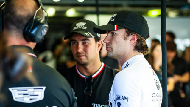 Colton Herta speaking with Sergio Perez in the Cadillac garage