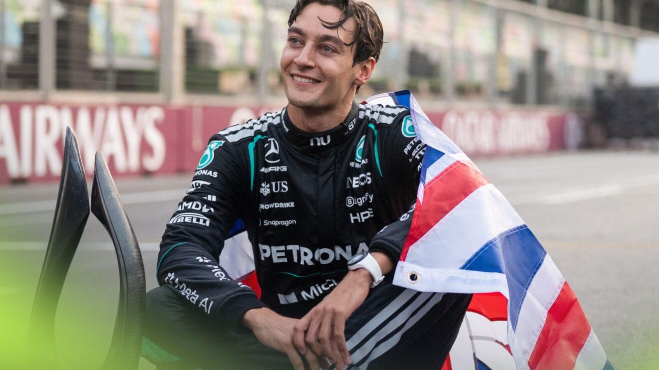 George Russell, Mercedes, poses with the British flag and P1 trophy after winning the 2026 Azerbaijan Grand Prix