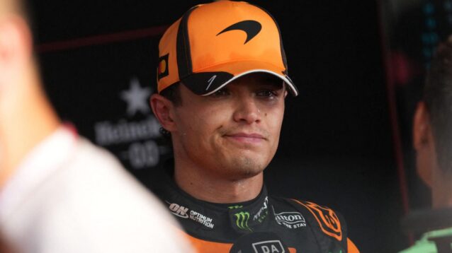 Lando Norris looks on while being interviewed after qualifying.