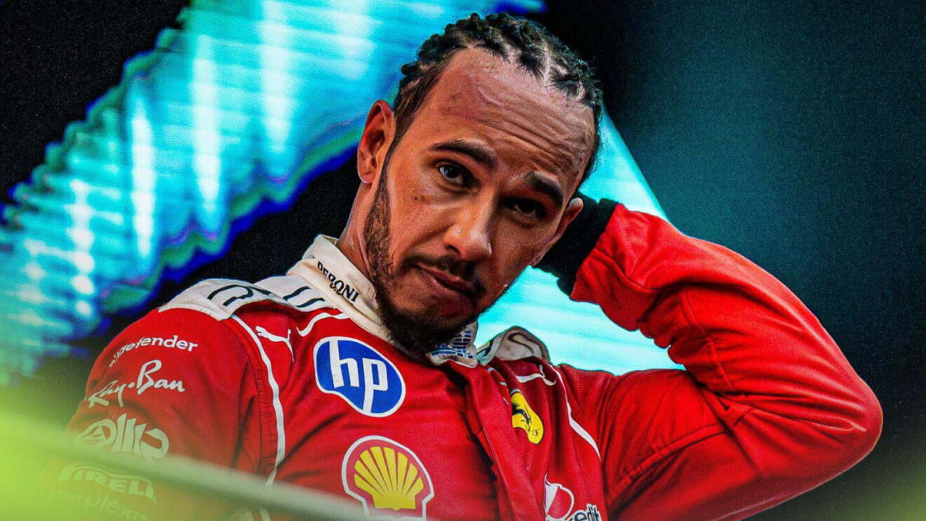 Lewis Hamilton scratching his head on the podium