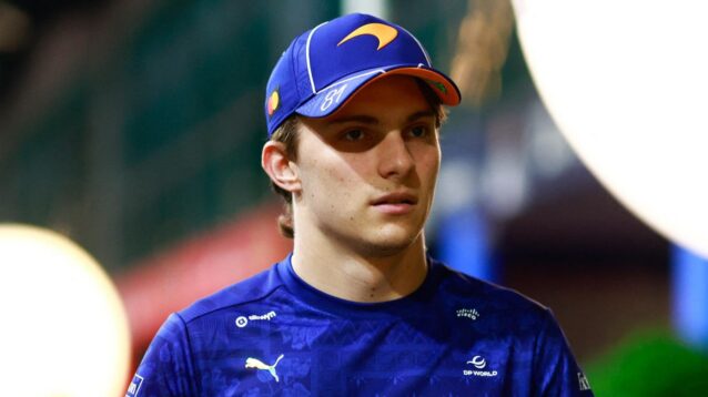 McLaren driver Oscar Piastri walks through the paddock.