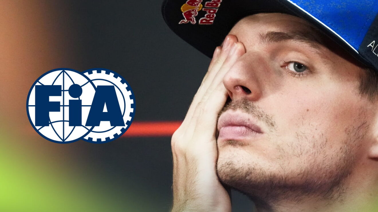 Max Verstappen holds one hand over his eye in a press conference with an FIA logo alongside him
