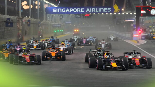 Max Verstappen's Red Bull leads as the field approaches Turn 1 at the start in Singapore
