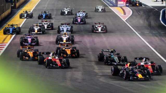 Max Verstappen's Red Bull leads the field into Turn 1 at the start in Singapore