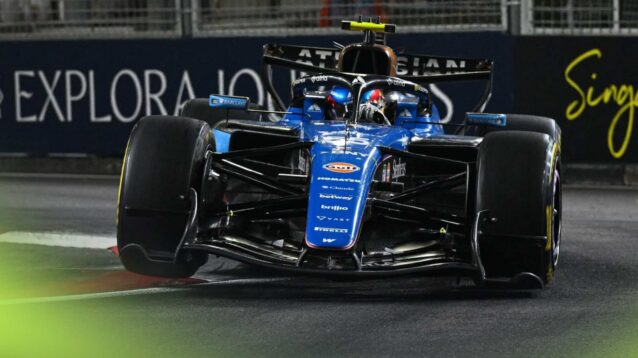 Williams driver Carlos Sainz runs over a kerb at the 2026 Singapore Grand Prix.