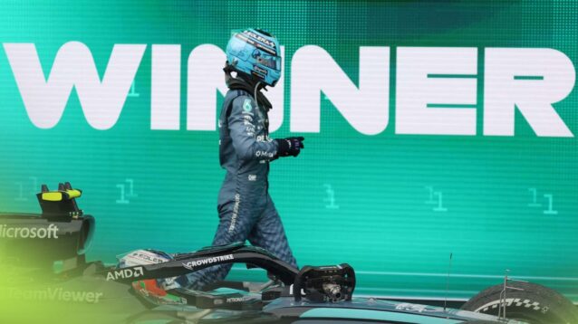 George Russell walks past Mercedes teammate Kimi Antonelli in parc ferme in Austin.
